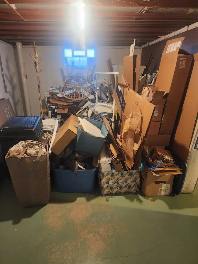 Roll-off dumpster container at job site for 2 Yard Dumpster Rental in Howell